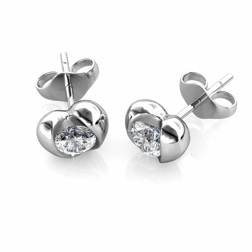 Heart Stud EarringsThis Heart Shaped earring features a round-cut crystal made with Crystals from Swarovski. These earrings are made in high quality brass with Rhodium plating.
FeatureEarringsDhia JewelleryDhia JewelleryHeart Stud Earrings